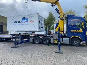 ArcticStore Tropical refrigerated container during transport and on-site installation by TITAN Containers.